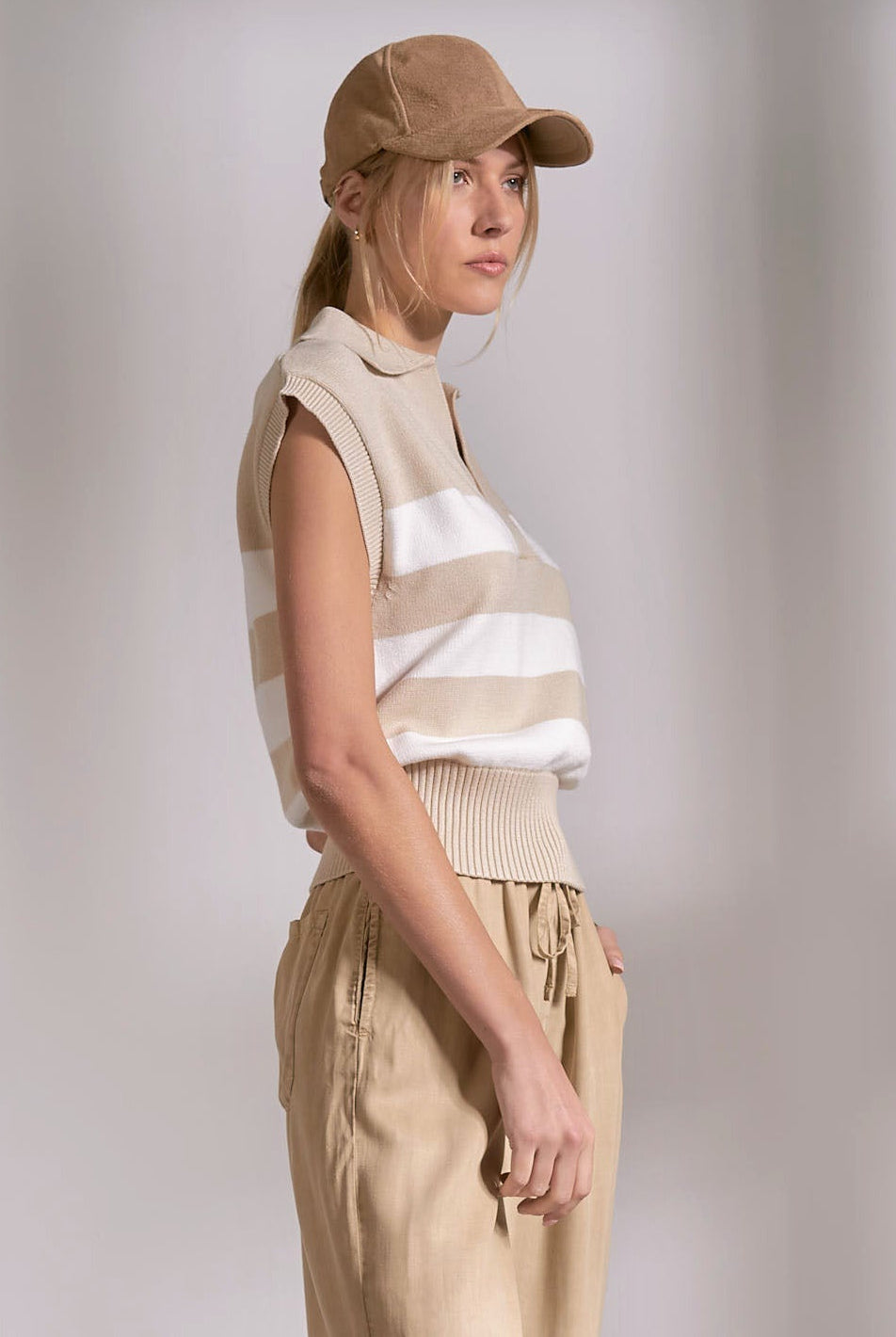 side of sleeveless collared sweater in beige