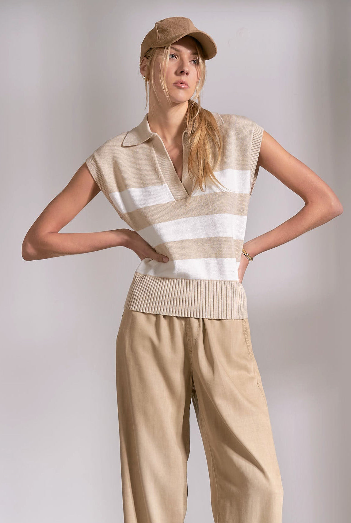 sleeveless striped collared sweater in the colors beige and cream