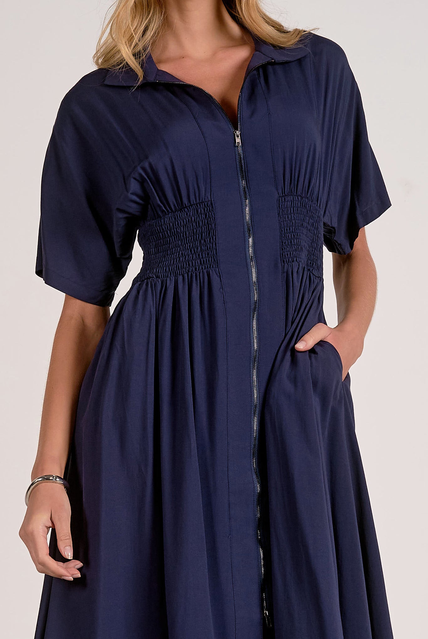 details on the navy smocked waist midi dress with relaxed skirt and flattering waist detail