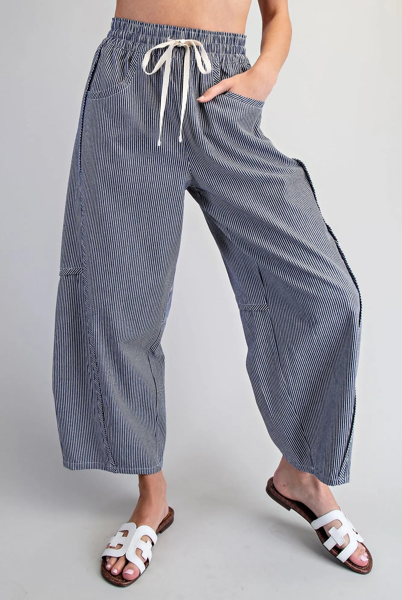 Relaxed fit navy striped pants with elastic waistband and pockets