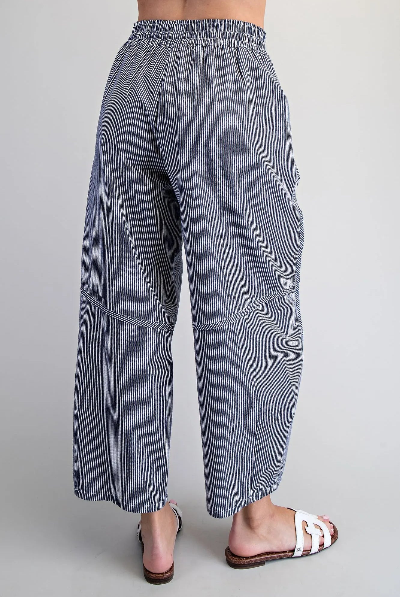 Back view of navy striped cropped wide leg pants
