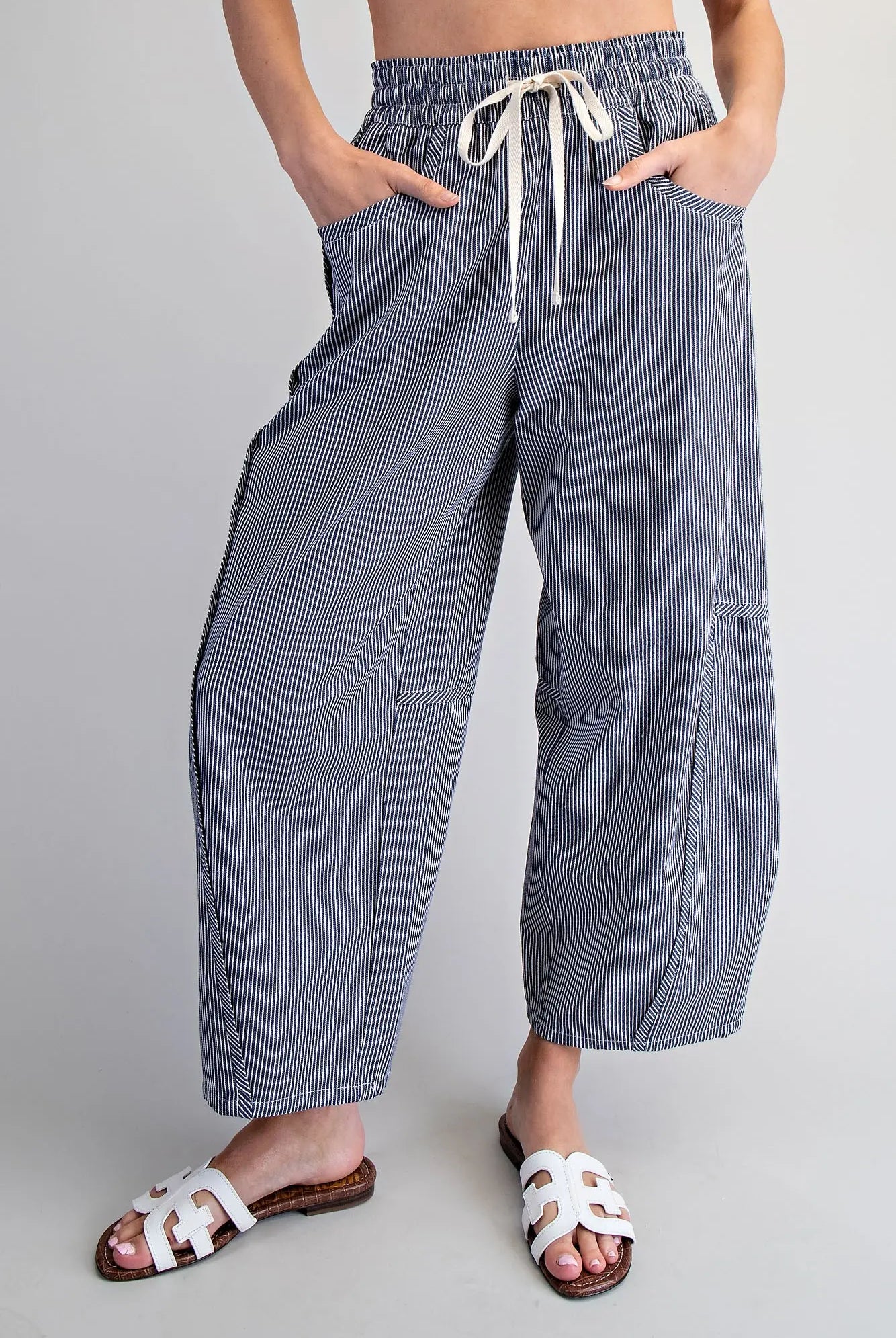 Relaxed fit navy striped pants with elastic waistband and pockets