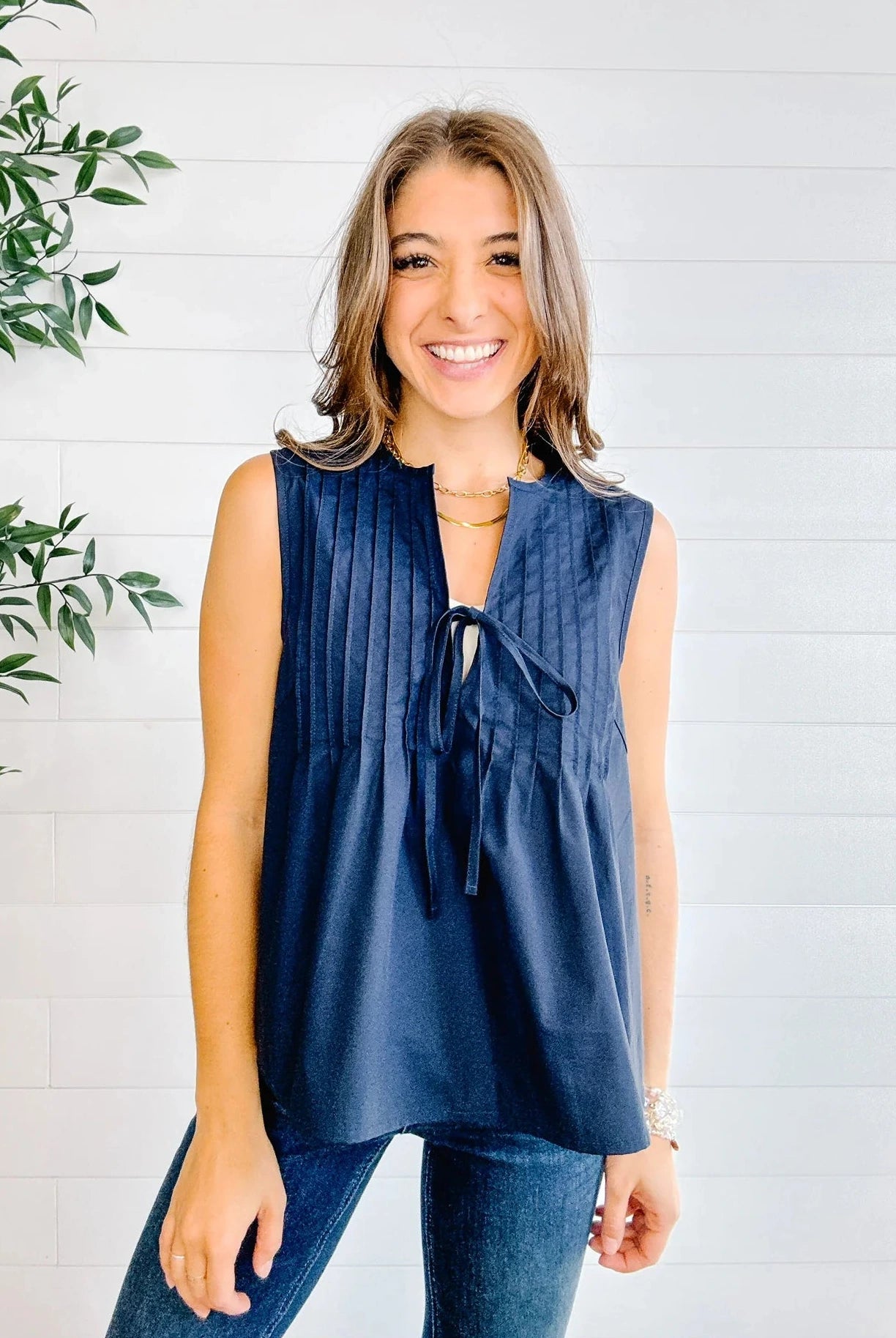 Relaxed fit navy woven top paired with denim