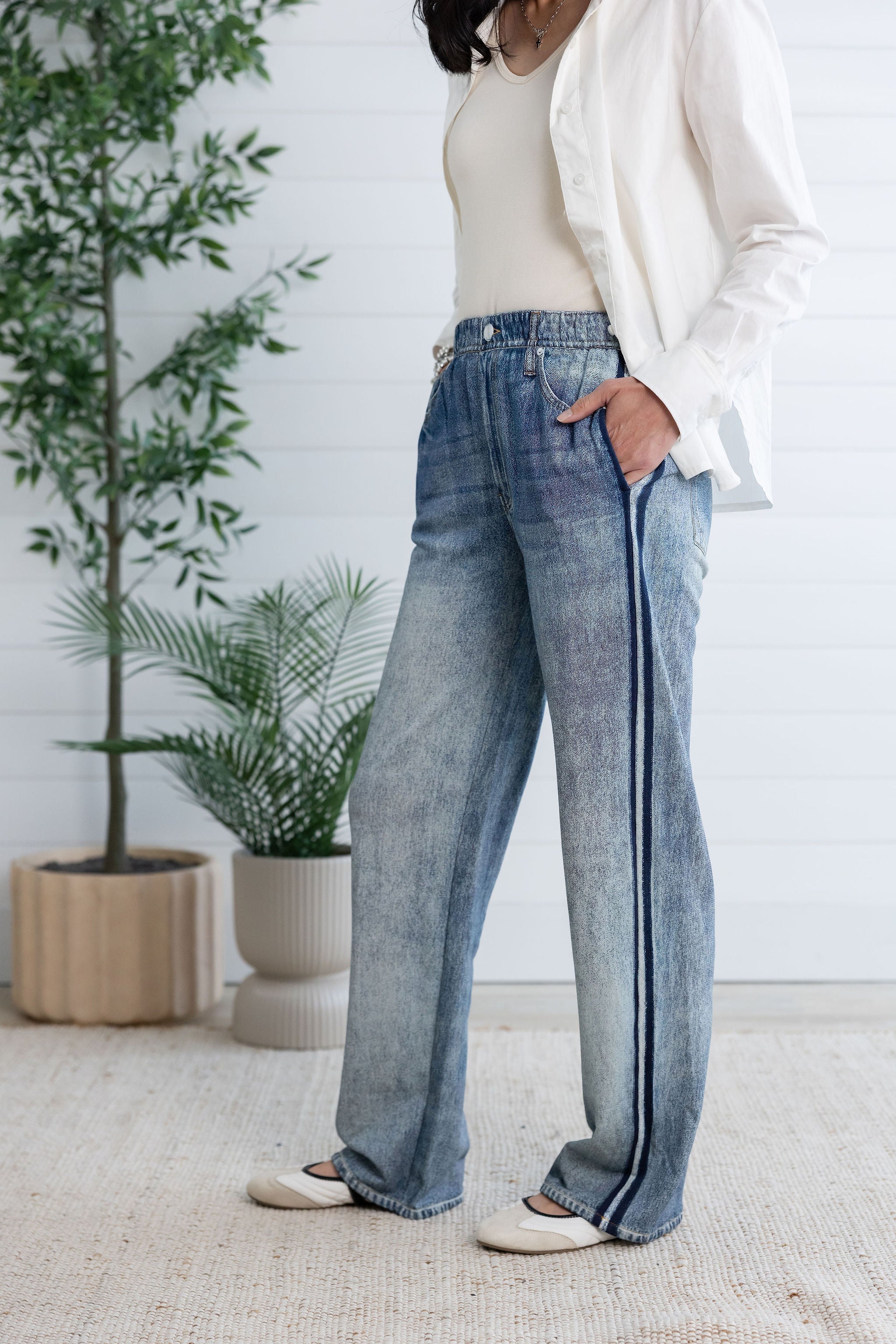 woman in side stripe sweatpant jeans 