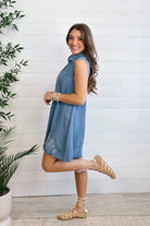 model showing side of Chambray Sleeveless Button Front Shirtdress