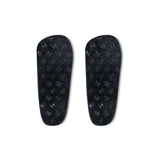 soles grips of the microwavable plush heated slippers with weighted spa bead upper