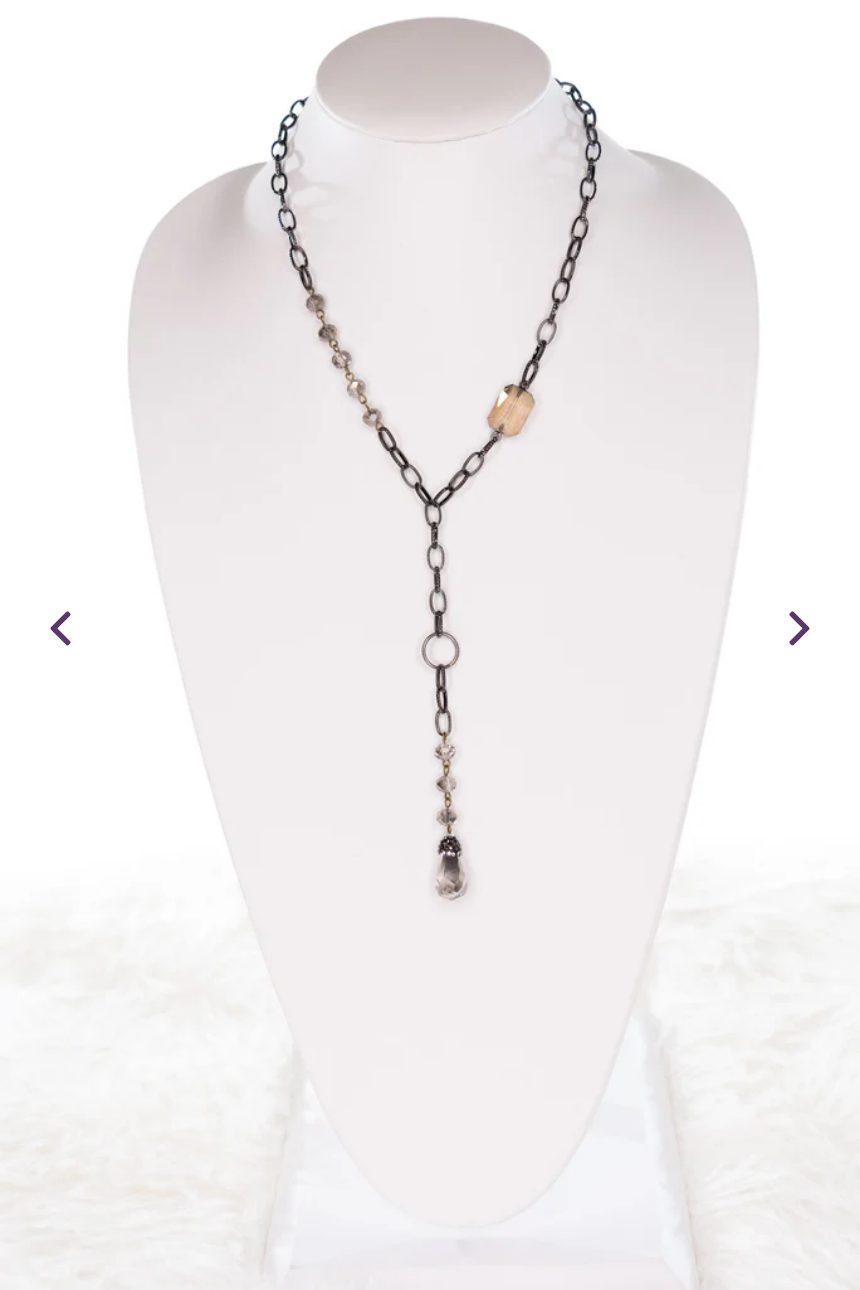 gunmetal lariat necklace adorned with crystals, beads and a crystal pendant.