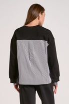 Black mixed media crewneck sweatshirt with striped woven back back view