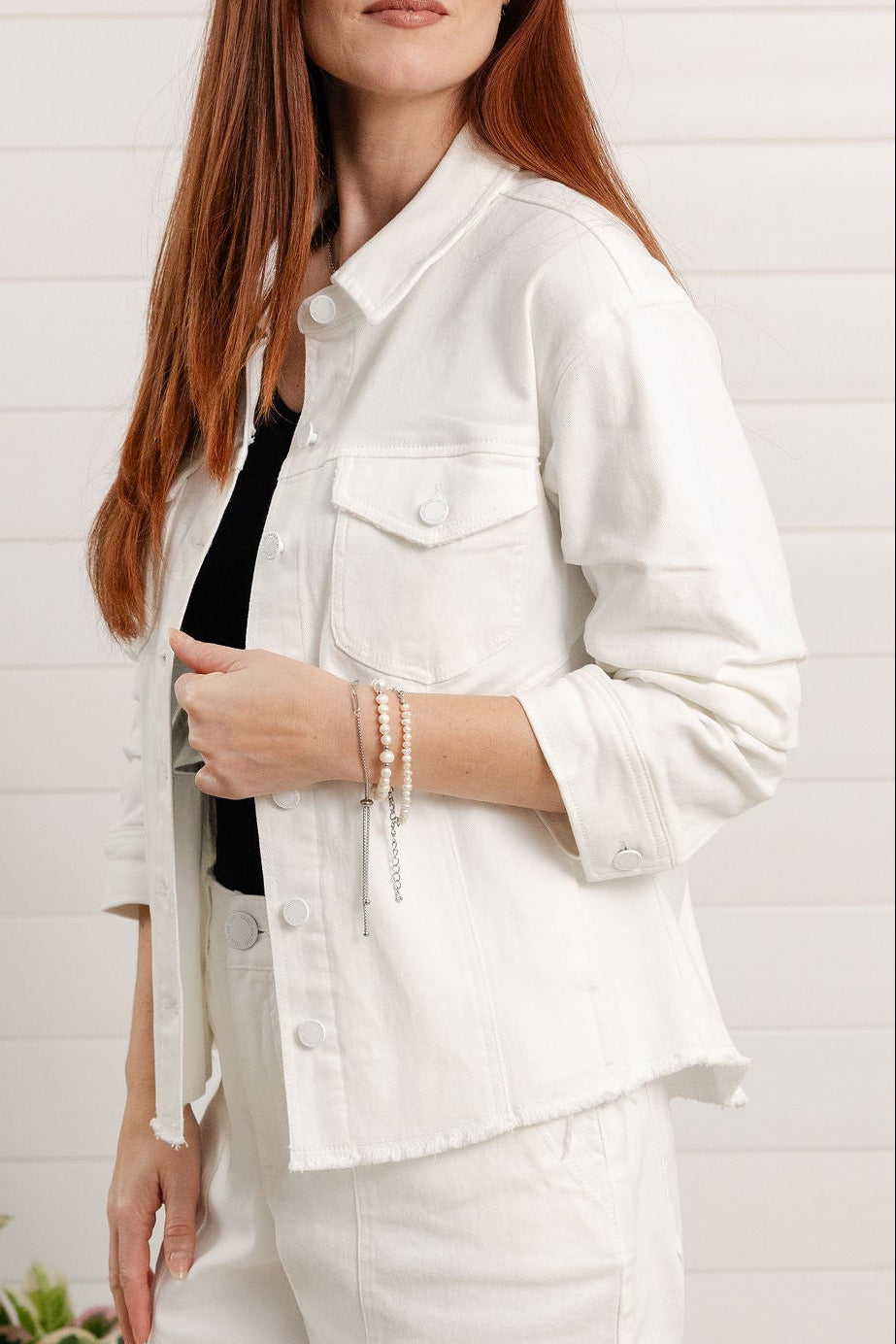 Close-up of ruched sleeve detail on Mac and Me white denim jacket