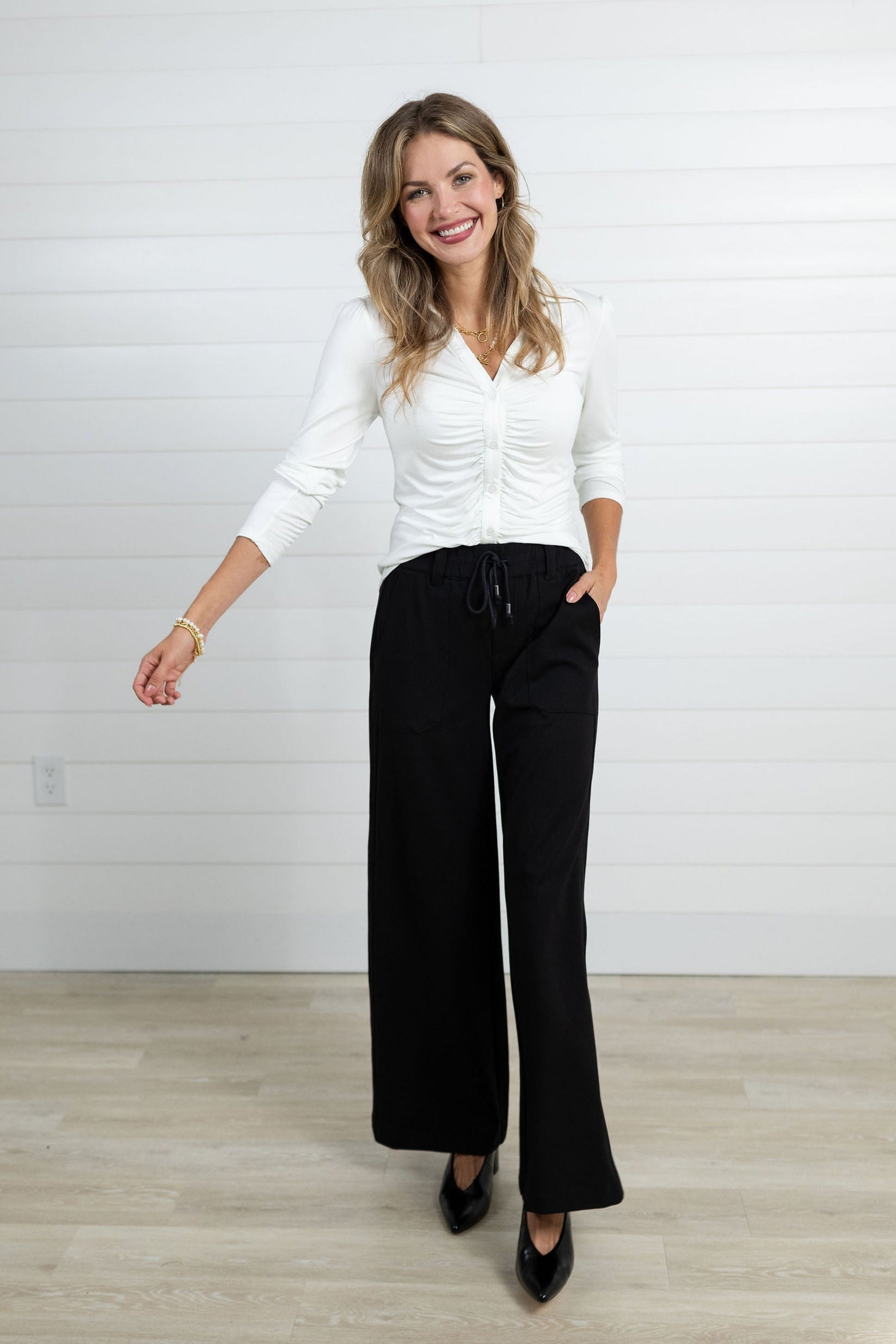 Woman walking in the black Mac and Me trouser.