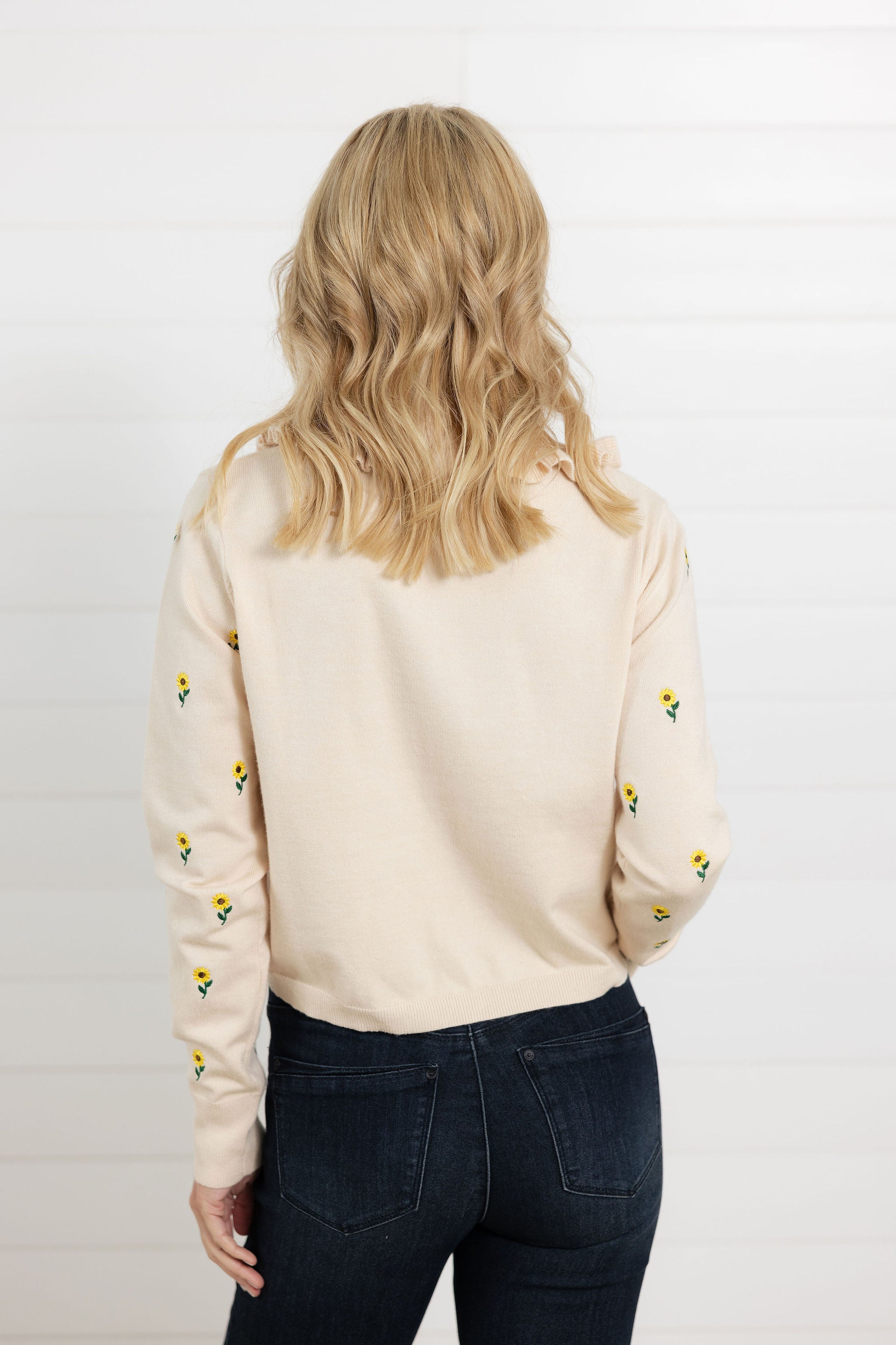 back view of Mac and Me cream embroidered sunflower sweater with ruffle collar front view