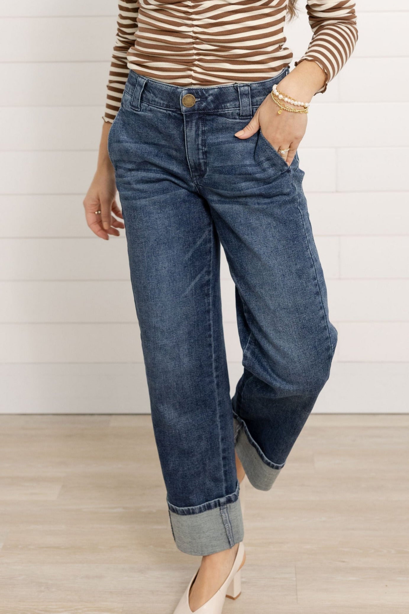 Mac modeling the Mac and Me Boyfriend Jeans.  She is wearing cream pumps and a striped top.