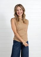 A woman wearing the Mac and Me Wide Leg Trouser Denim with the Mac and Me Funnel Neck Mac and Me top in the color Carmel.  This outfit styled together makes a perfectly styled fall staple!