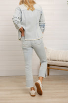 back view of Mac and Me bleached blue front seam kick flare jeans frayed hem