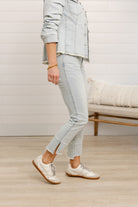 side view of Mac and Me bleached blue front seam kick flare jeans frayed hem