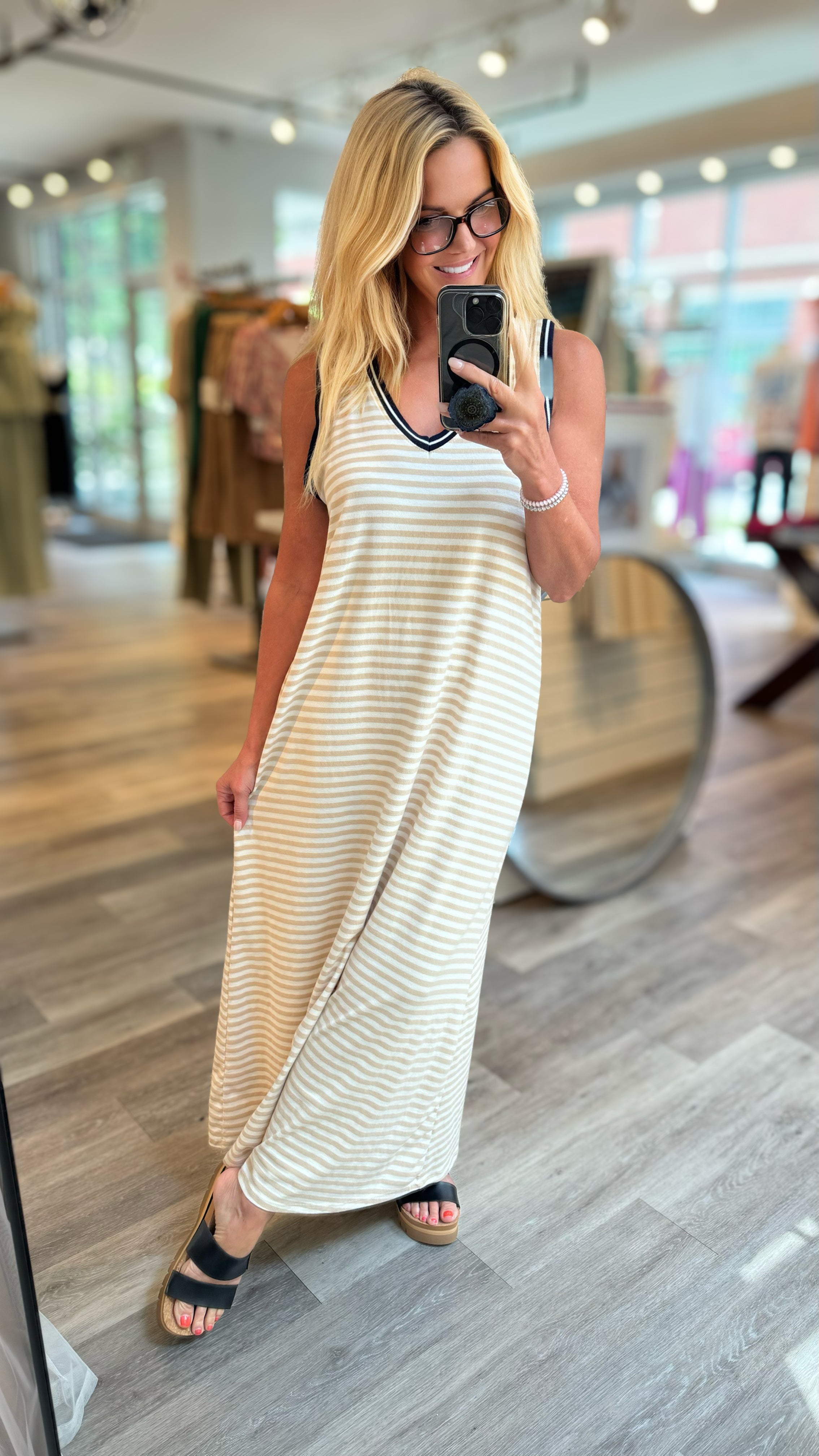 A lady wearing a nautical striped dress