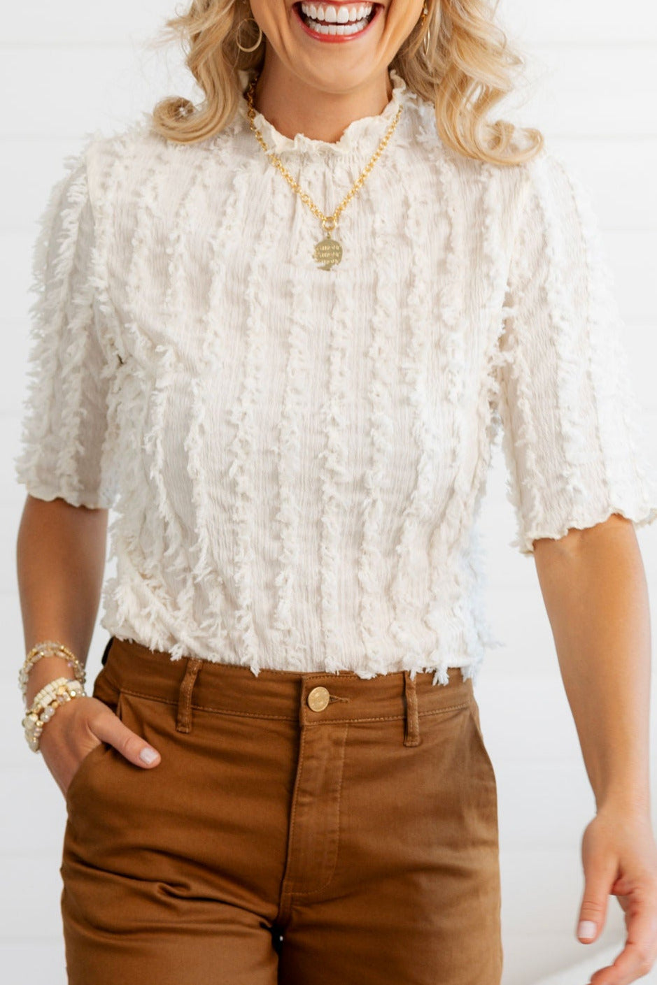 Close up details of the Ivory Lettuce Edge Textured Knit Top