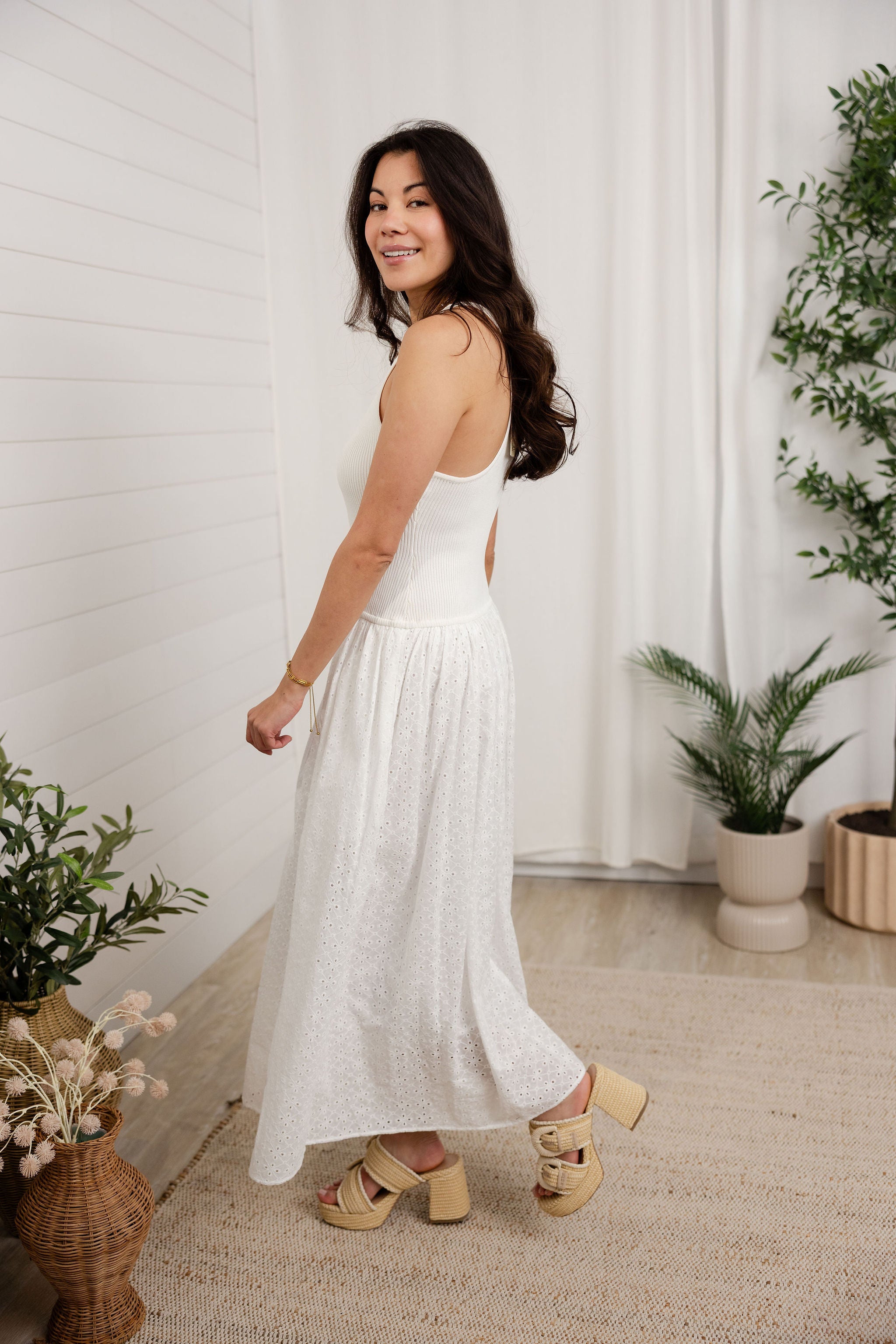 woman wearing the white mixed media dress 