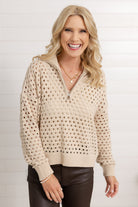 Woman wearing the open knit quarter zip sweater at Mainstream Boutique Bloomington.