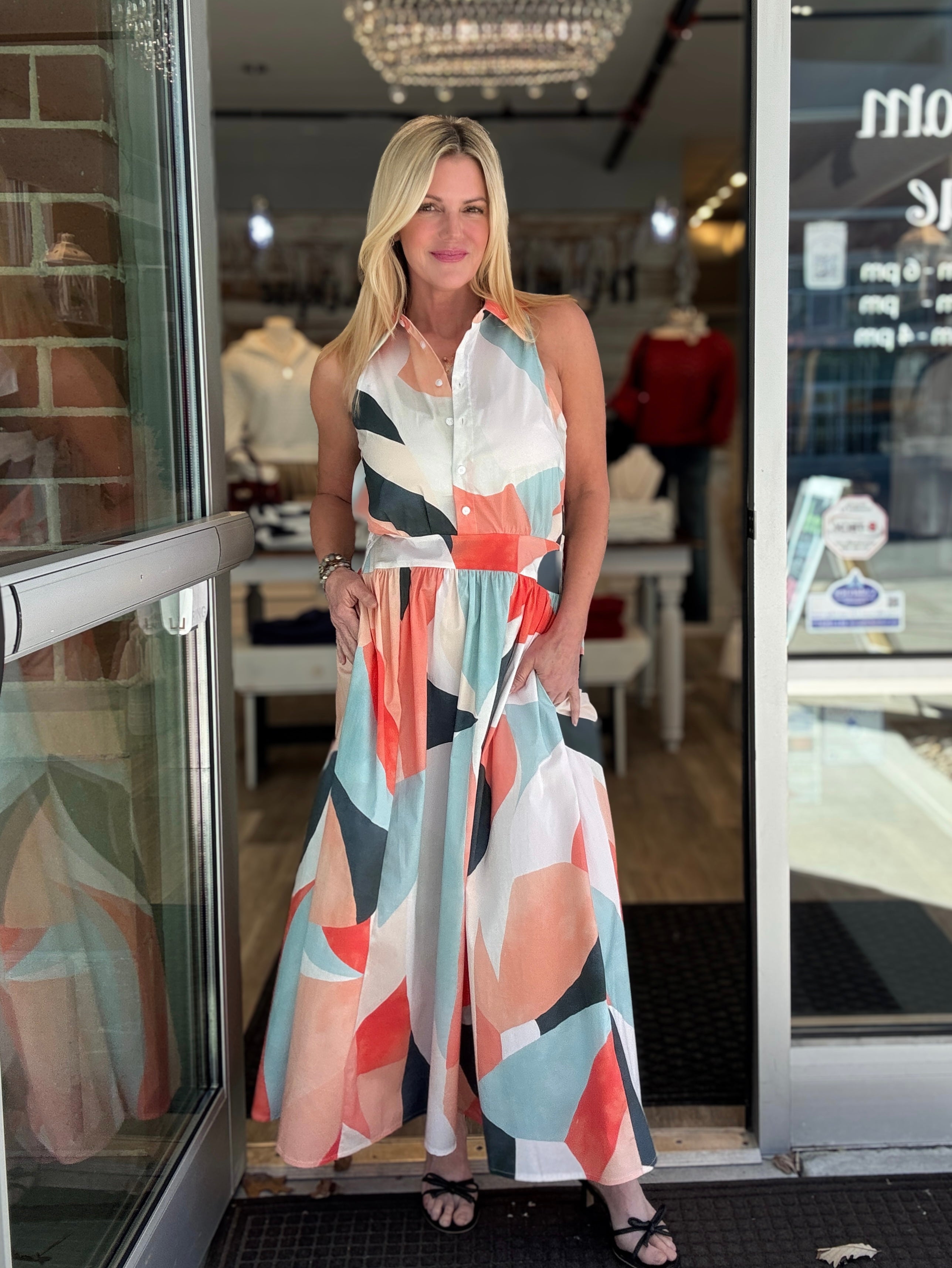 Woman wearing a colorful prism print midi dress 