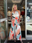 Woman wearing a colorful prism print midi dress 
