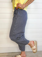 navy striped relaxed fit pants side and close up view