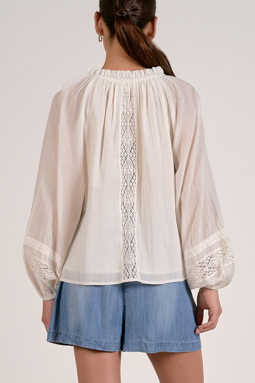 soft white blouse with lace detail and long sleeves back view