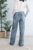woman modeling back of lounge pant, the light blue Side Stripe Relaxed Denim Pant