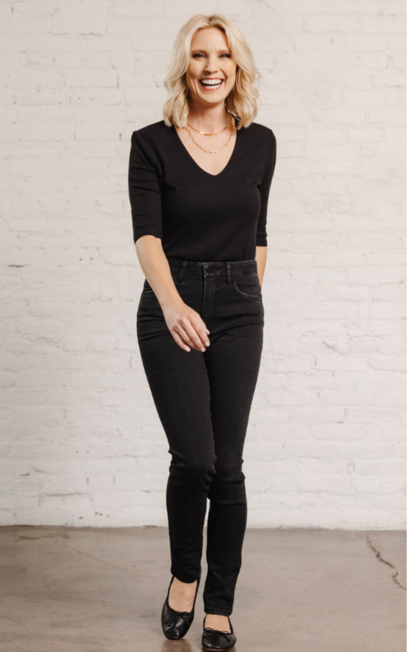 woman wearing the high rise black skinny jeans by Mac and Me