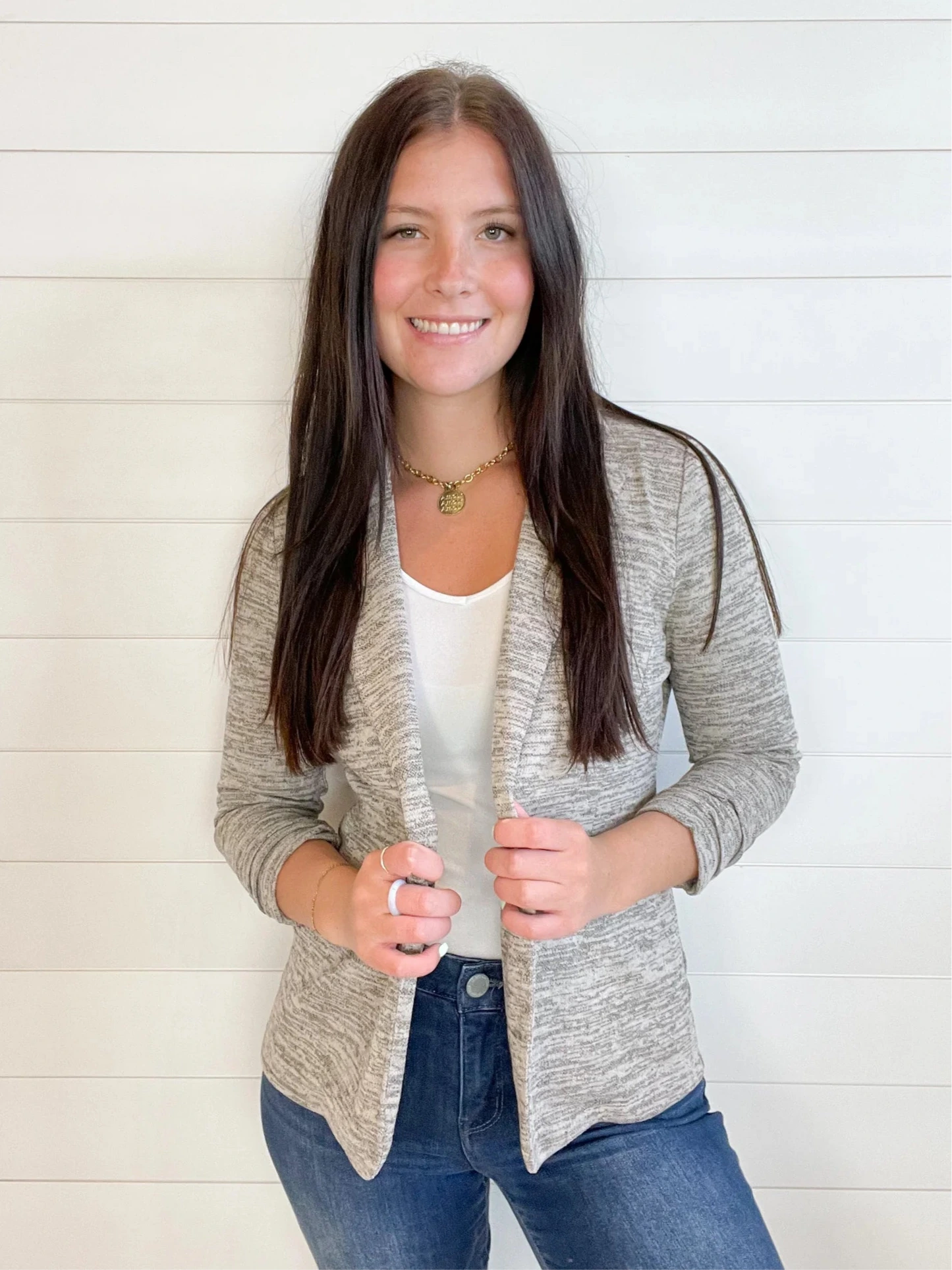 young woman wearing a toffee knit blazer with shirred sleeves front view