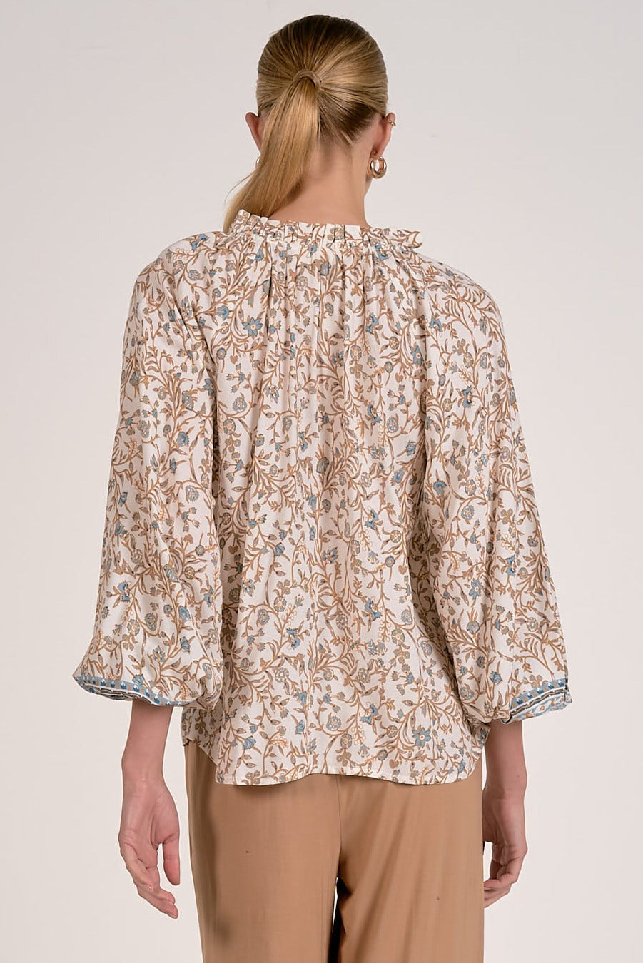 back view of blue floral print blouse