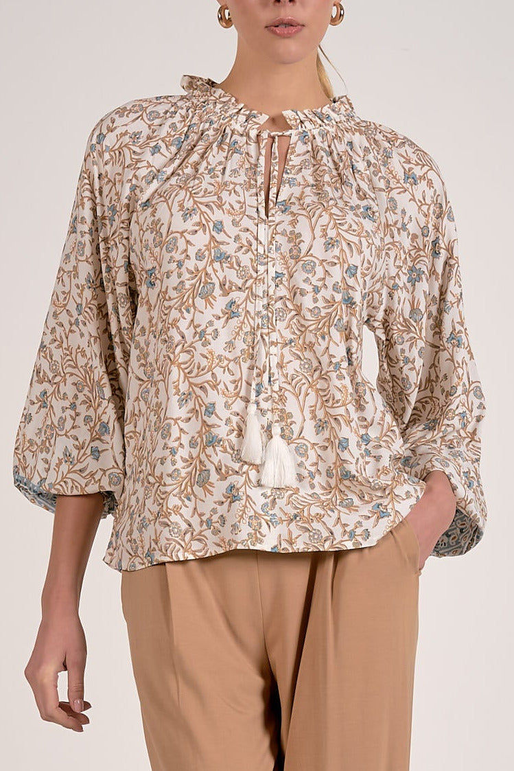 blue floral tie front blouse with tassel detail close up view