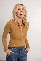 woman showing the front of the mac and me camel colored ribbed henley