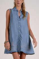 close up view of chambray dress embroidered hem detail relaxed fit summer dress