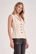 Natural linen blend vest with cinched waist and peplum, side view