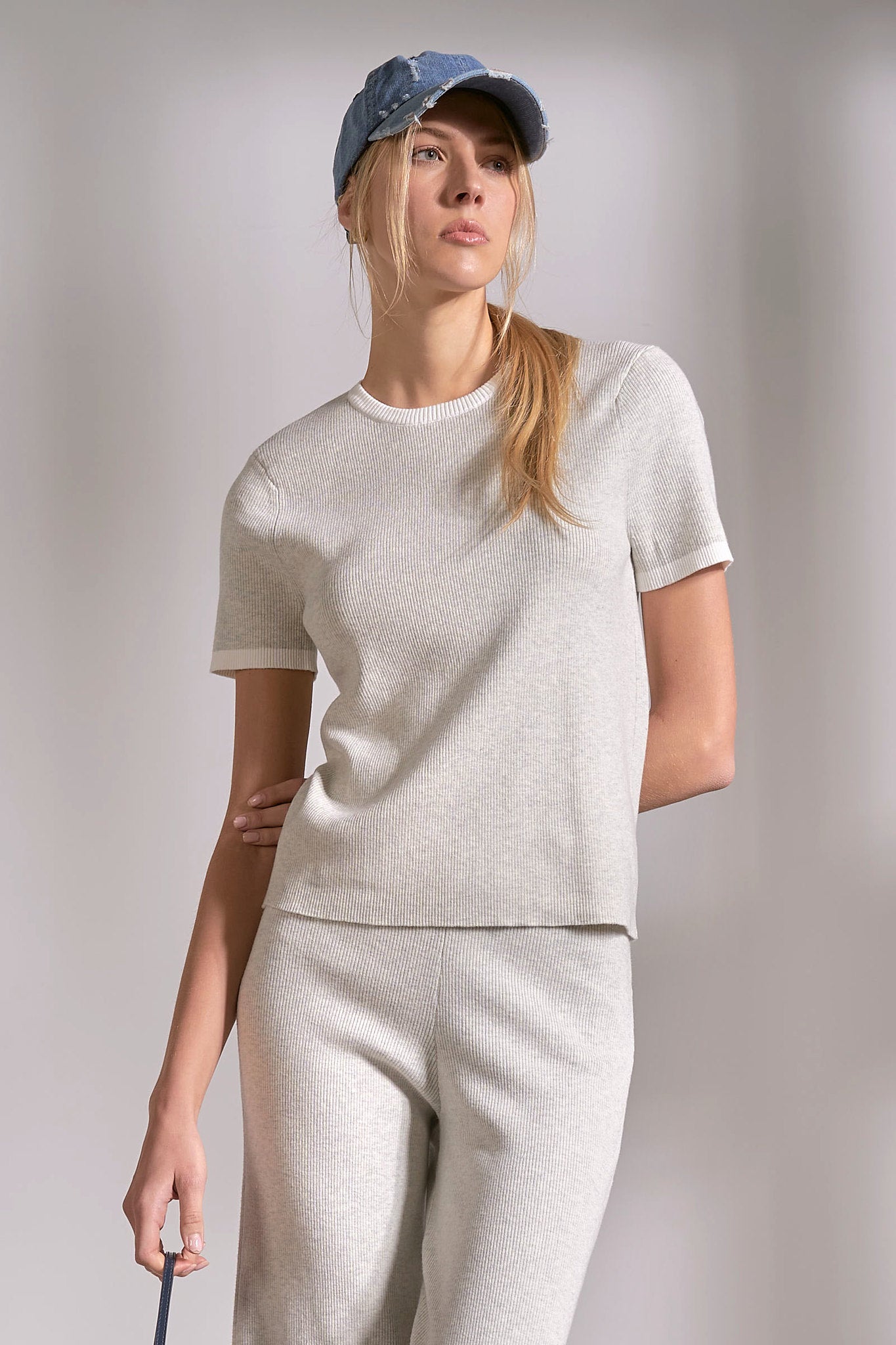 Grey ribbed crewneck top with white stripe detail on neckline and sleeves