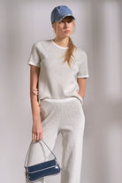 Grey ribbed crewneck top with white stripe detail on neckline and sleeves