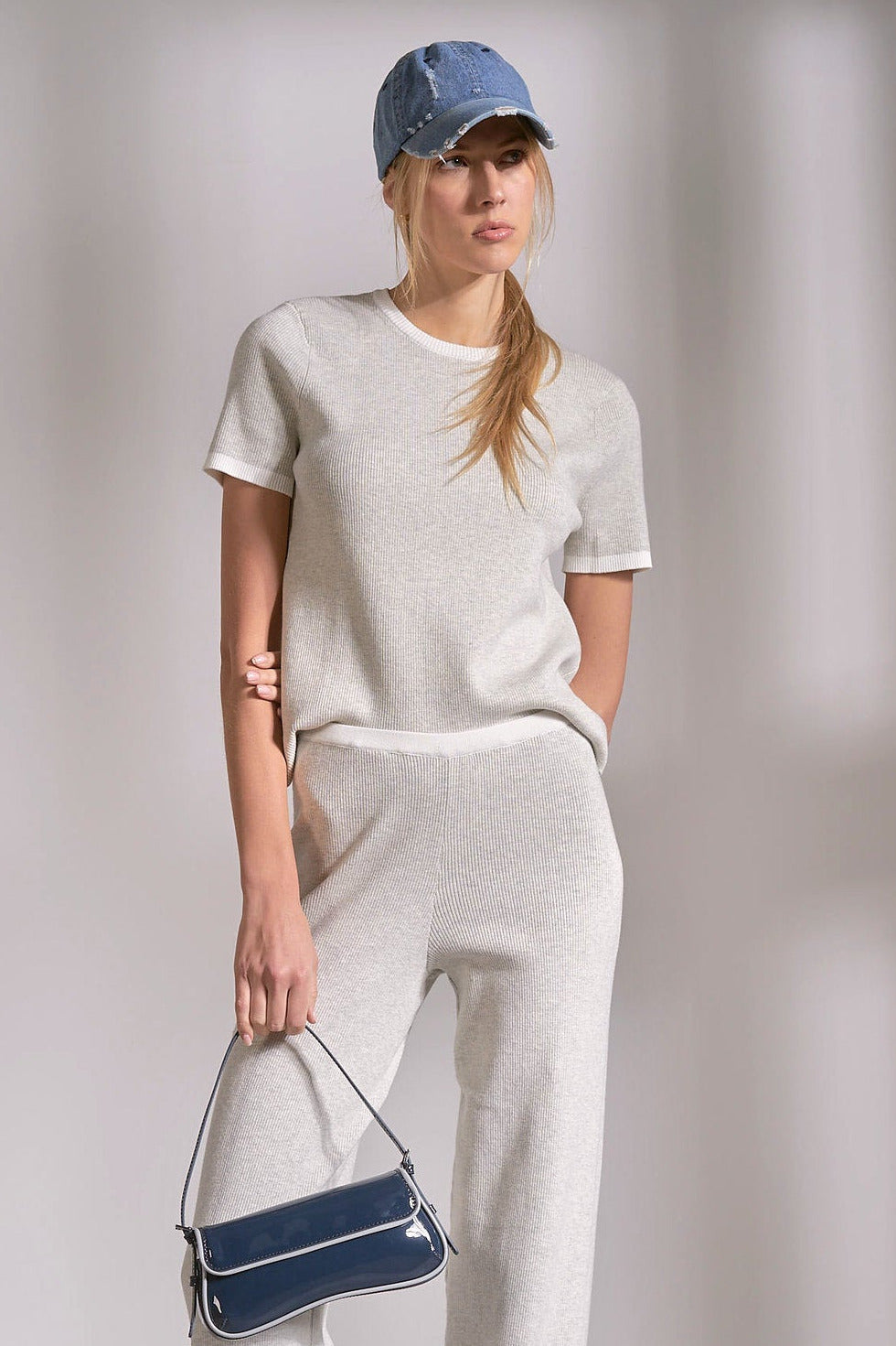 Grey ribbed crewneck top with white stripe detail on neckline and sleeves