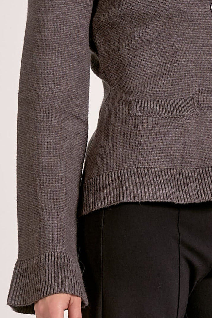 Showing the details of the graphite flare cuff button cardigan