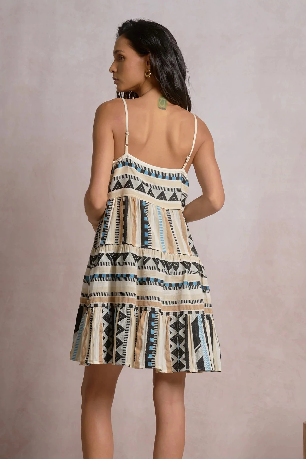 back of geometric stripe tiered mini dress with adjustable spaghetti straps