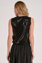Woman modeling the back of the black sequin glitter tank top 