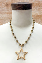 gold and bead short necklace with an open star pendant