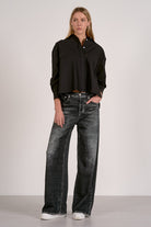 Model wearing grey wash wide-leg comfort jeans from Mainstream Boutique Bloomington, part of our $15 off Denim Days event.