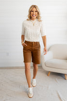 Woman walking wearing the Ivory Lettuce Edge Textured Knit Top