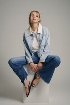 model in the blue wash denim jacket