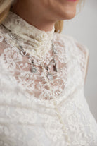 Mac and Me ivory lace mock neck top close-up floral detail