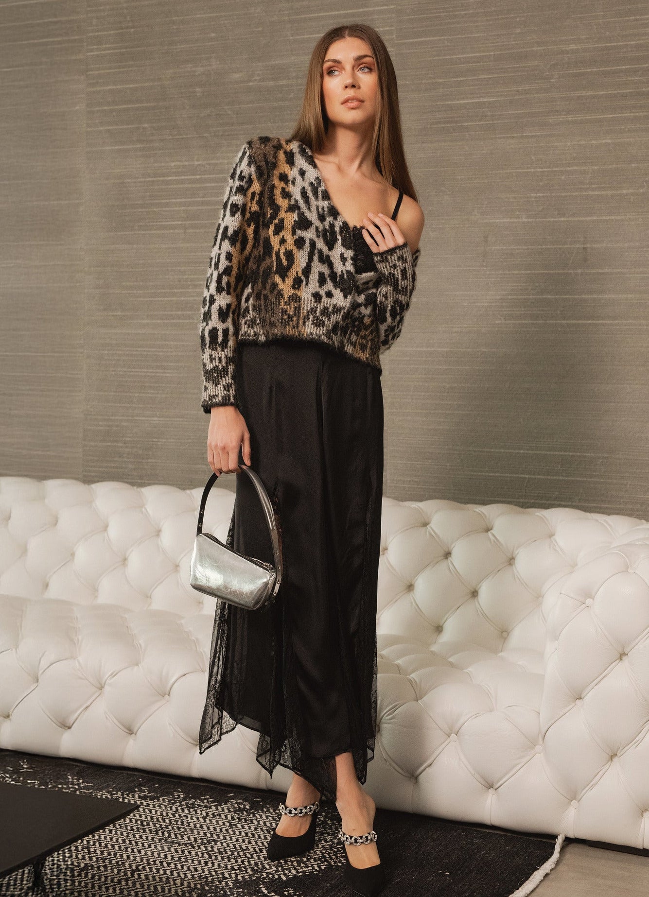 Model wearing Meet & Greet Eyelash Leopard Cardigan in fuzzy eyelash knit with leopard print and button-front closure from Mainstream Boutique Bloomington