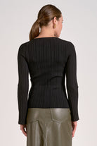 Back side of black ribbed bell sleeve long sleeve top for women