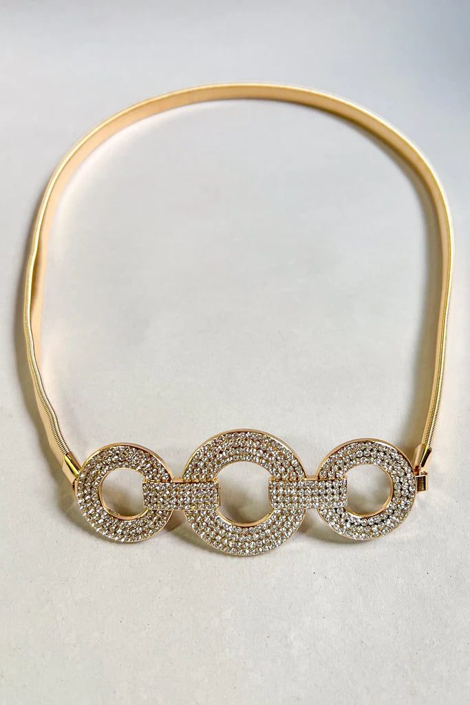Gold stretch belt with oval rhinestone buckle