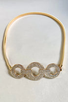 Gold stretch belt with oval rhinestone buckle